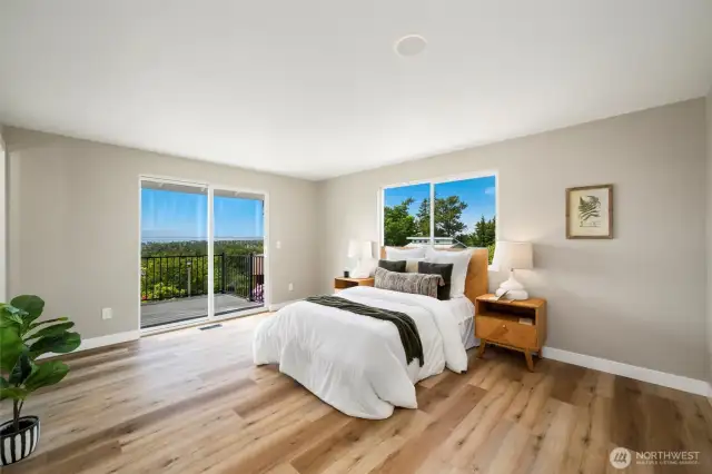 Spacious and serene primary suite with large sliding glass and sleek modern finishes—your private retreat at the end of the day.