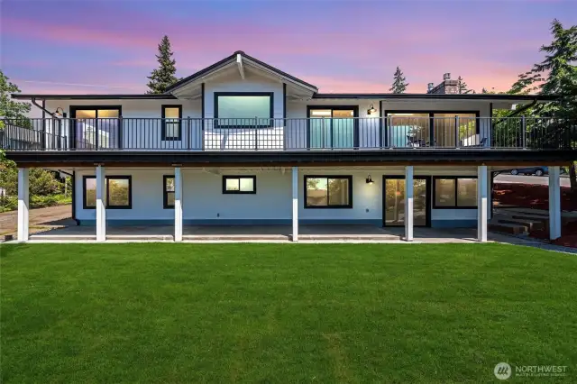 Soak in sweeping views from this beautifully updated home, featuring expansive decks, fresh landscaping, and a modern aesthetic that shines from every angle.