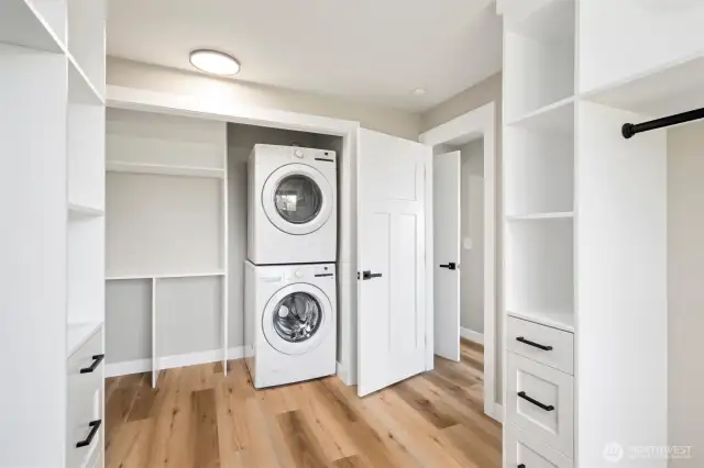Convenient in-room laundry tucked inside the walk-in closet—streamlined function meets everyday luxury.