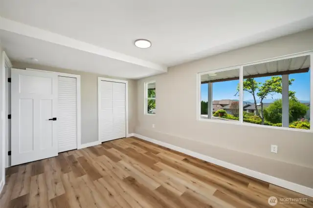 Well-proportioned bedroom with backyard views and flexible layout options.