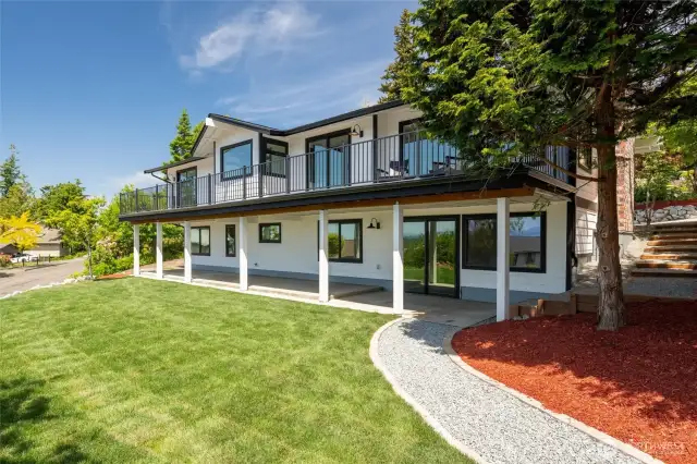 A second private entry from the street provides flexible access to the lower level—ideal for guests, multi-generational living, or a potential separate suite.