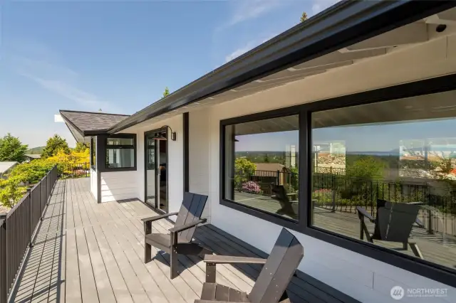 Expansive deck with peaceful territorial and bay views—an ideal perch for relaxing or hosting guests in style.