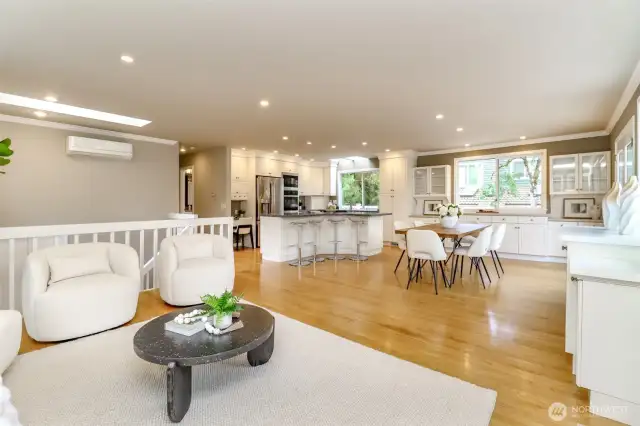 Large living room space, open, spacious and filled with natural lighting and skylights.