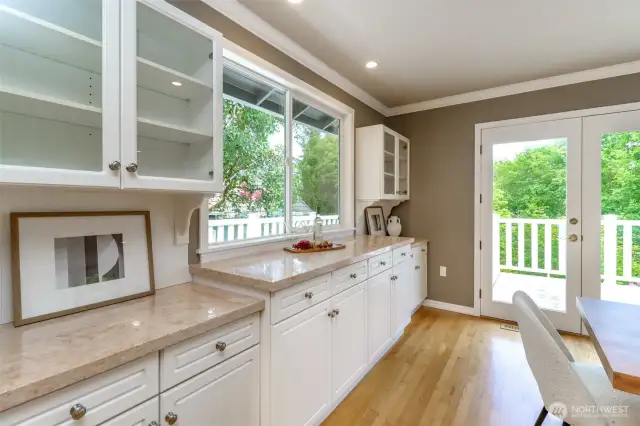 Extensive cabinetry with glass door storage. Updated granite counter tops, great for entertaining.