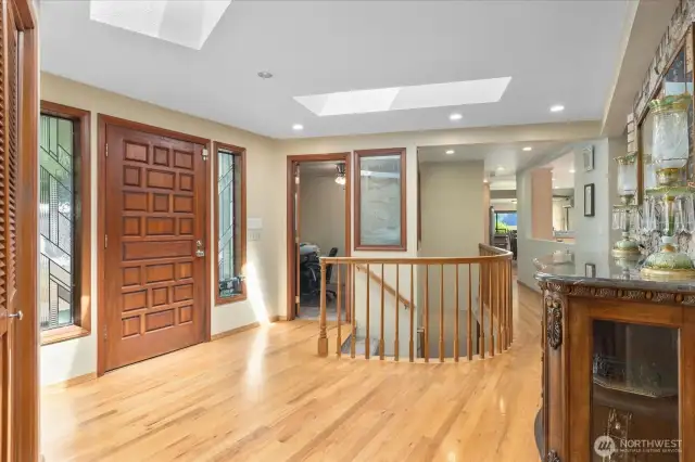 Skylights stream in lots of natural light into your entry way providing a warm welcome to you & your guests. A coat closet is conveniently located next to a built in bench offering ease as you come and go.