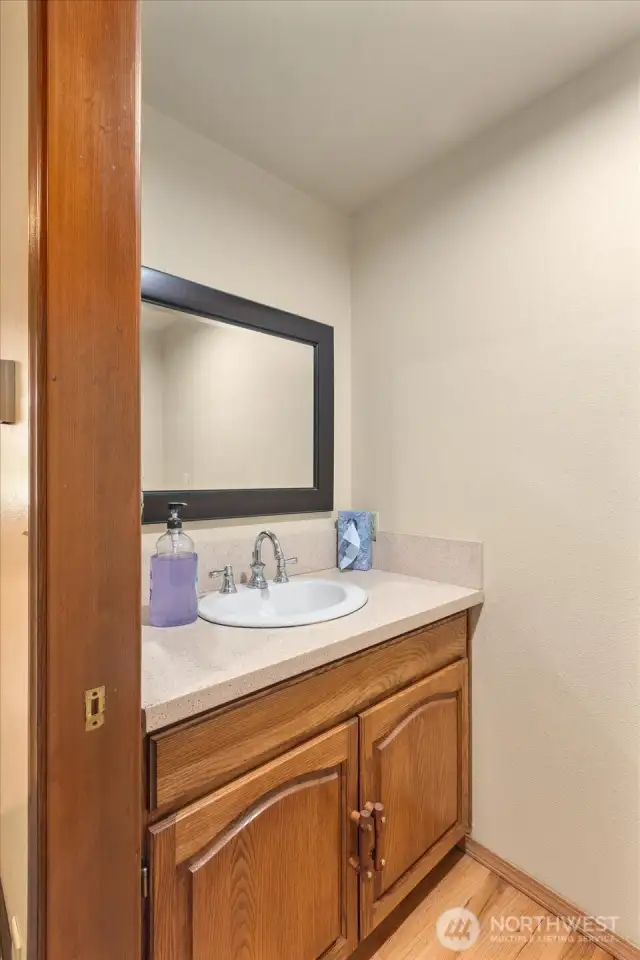 Right off your laundry room is a half guest bathroom.