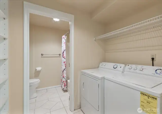 Your MIL has its own laundry room complete with lots of storage.