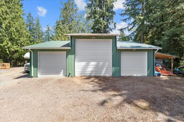 6 car garage with carport! A mechanic's dream with high bay door, power, heat & plumbed for an air compressor! There's plenty of room for all your vehicles, toys, work trucks & more! RV parking is effortless with a dump station & a circular driveway. You'll find additional shelter with the carport.
