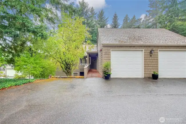 End corner unit on upper floor. No stairs. 1-car garage with garage lofted storage.