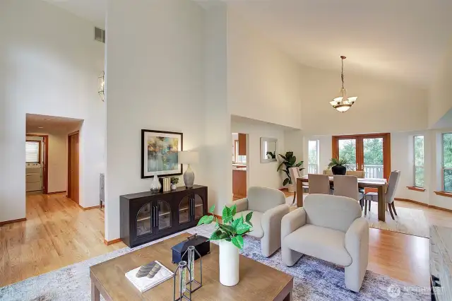 Main Level Grand Living and Dining Rooms with Vaulted Ceilings