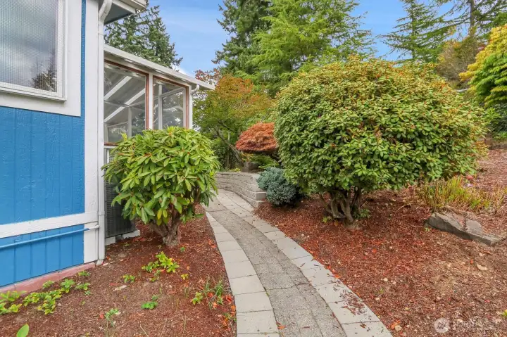Walk-Way to the Front Porch to the Backyard Covered & Partially Enclosed Deck
