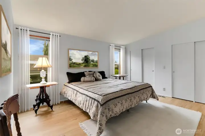 Partially VIRTUALLY STAGED - Primary Bedroom features King-Size Bed - Double Closets -Blinds on all Windows