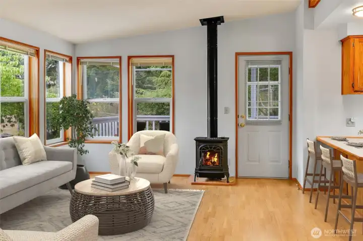 VIRTUALLY STAGED - Family Room with Walls-of-Windows & Door that leads to the  Covered & Partiall Enclosed Deck that view the 6th Hole on the Golf Course