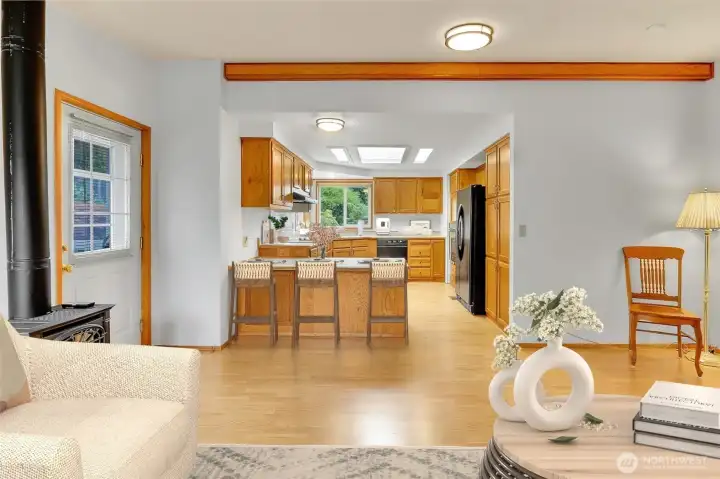 VIRTUALLY STAGED - Family Room features a Free-Standing Propane Stove