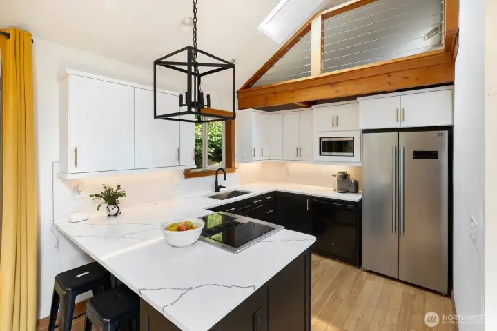 Kitchen fully remodeled in 2020 with marbled quartz countertops.