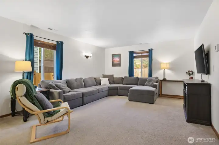 Large enough for this sectional and still room to spare, the living room offers two windows and lots of options for furniture placement.