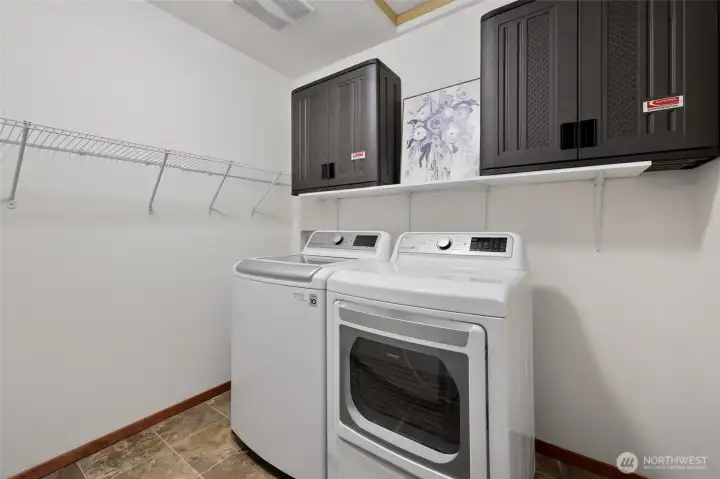 Upper level laundry room means no hauling of loads up and down the stairs! How nice to have a dedicated room where you can close the door. :)