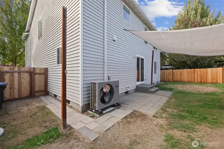 Recently installed heat pump means efficient heat and cool air in the summer! The new gate on the side is a welcome access between front and back yards.