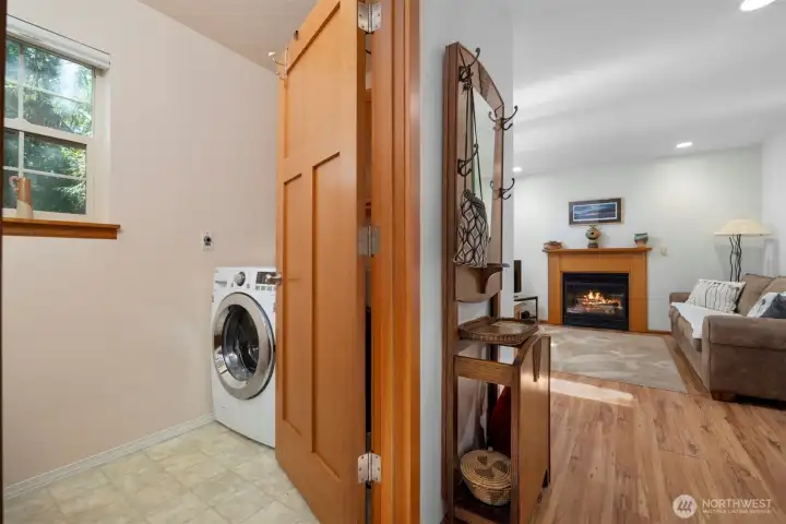 The laundry room is on the main floor and is in the powder room adjacent to the family room.