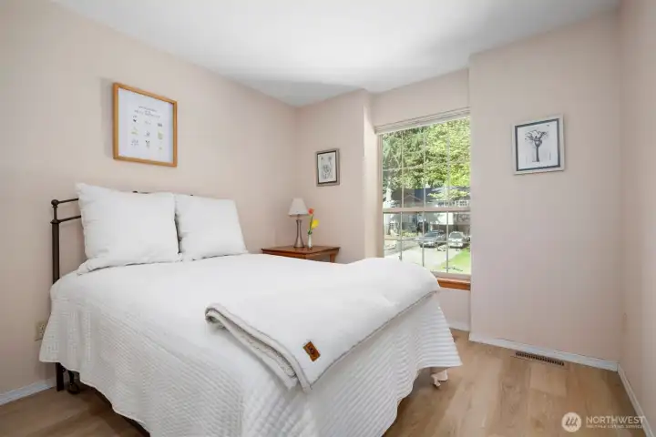 Another bedroom that is large and looks towards the front of the home.