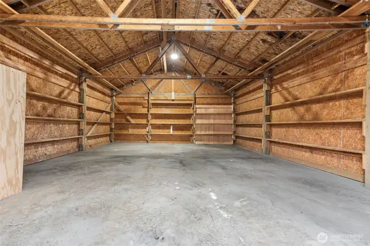 View of back side of the garage/shop.  Doors lead to back of property.