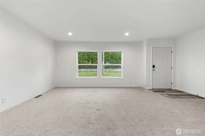 Upon entering the home you have canned lighting, plus two large windows allowing so much light into the spacious living room.