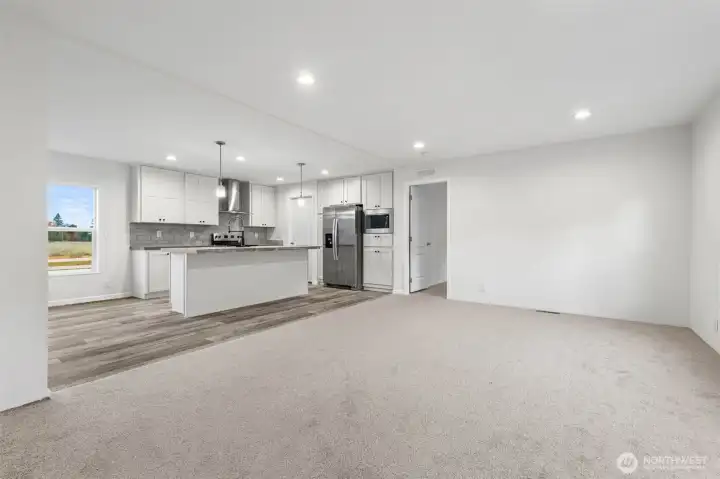 Open concept living from the living room to the kitchen and dining room to keep entertaining welcoming.