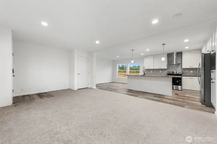 View seeing entire living, dining and kitchen.