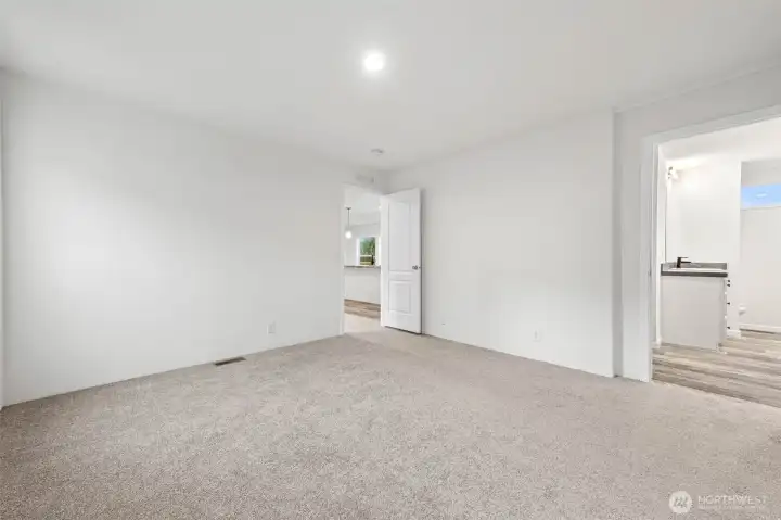 View looking back to living area and to the right is the primary bath.