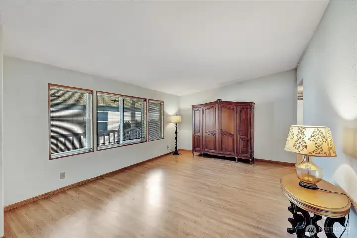 Spacious family room (or use as the living room) looks out to the covered from deck.