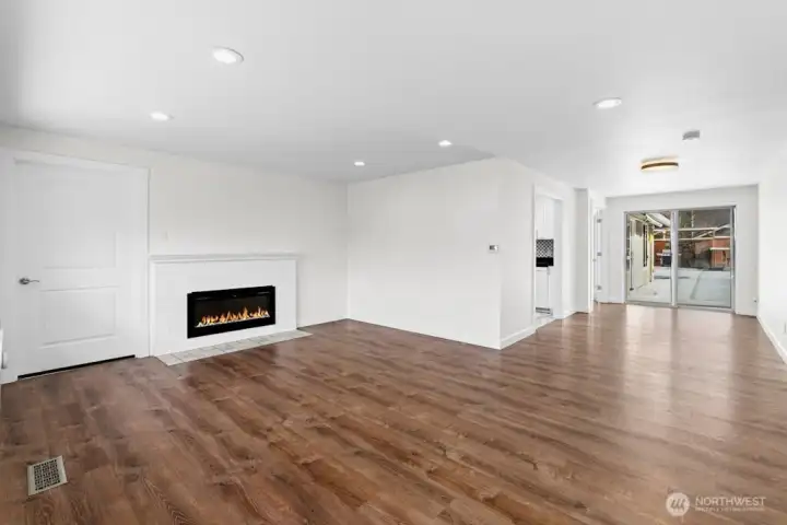 Living room and dining with pool outside