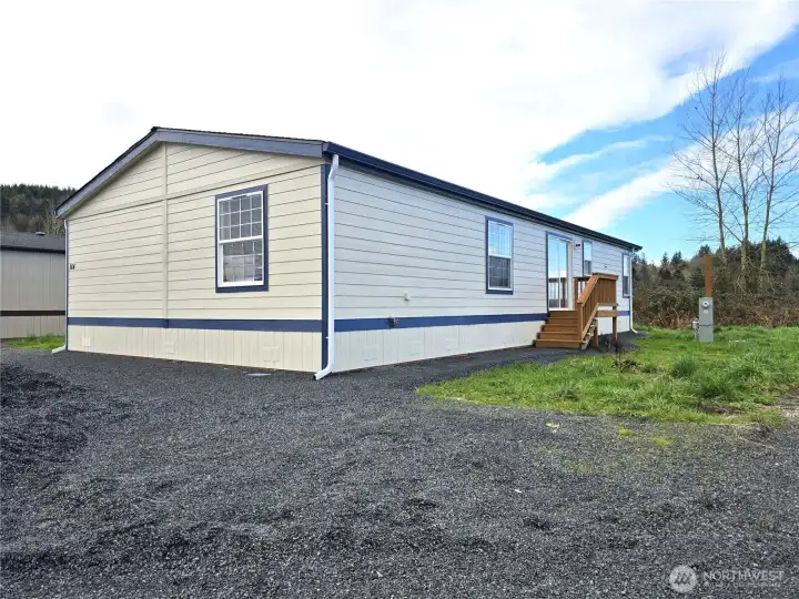 Fresh exterior paint and welcoming updates including, skirting, decks and parking area set the tone for this move-in ready home in Country Life Estates.
