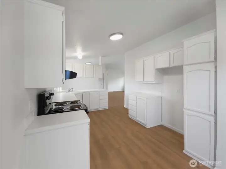 Well-designed workspace with great flow into the dining room and breakfast nook—ideal for cooking and gathering.