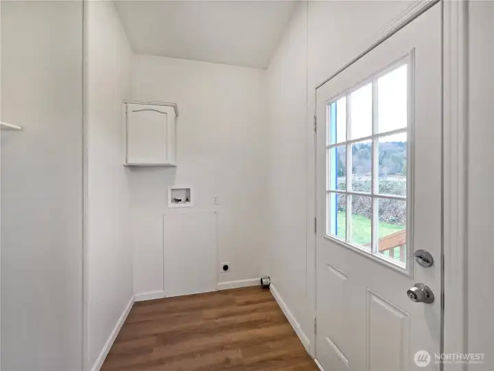 Well-placed laundry room with access to the back porch, providing easy entry for outdoor projects making outdoor projects easy access.