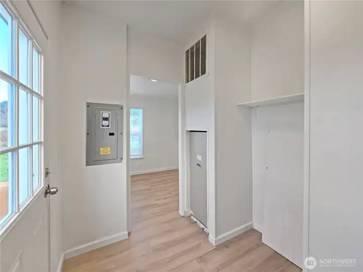 View from the laundry area toward the breakfast nook, where natural light and farm views create a welcoming space.