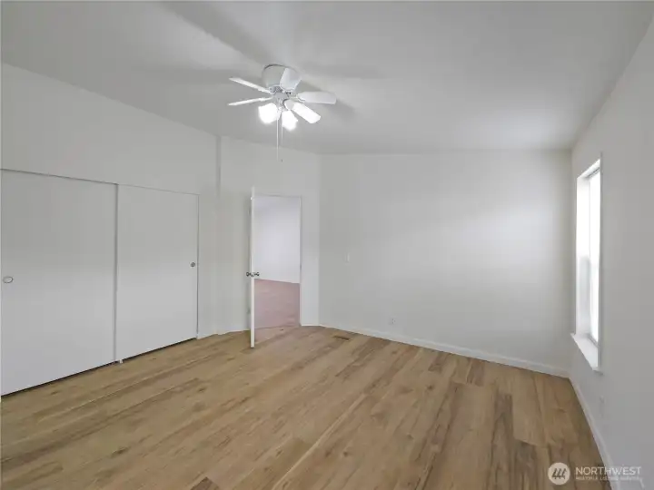 Primary bedroom with a large closet offering ample storage to keep your home organized.