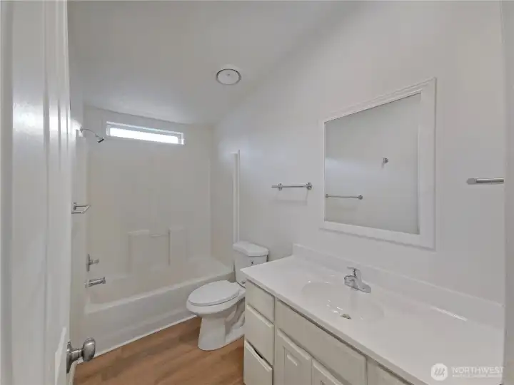 Full hall bath serving guest bedrooms with clean finishes and a practical design.