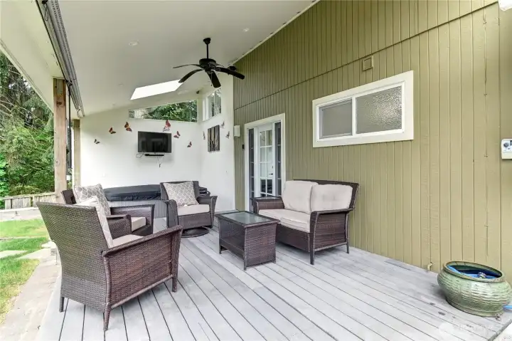 Covered deck with hot tub, lighting and TV