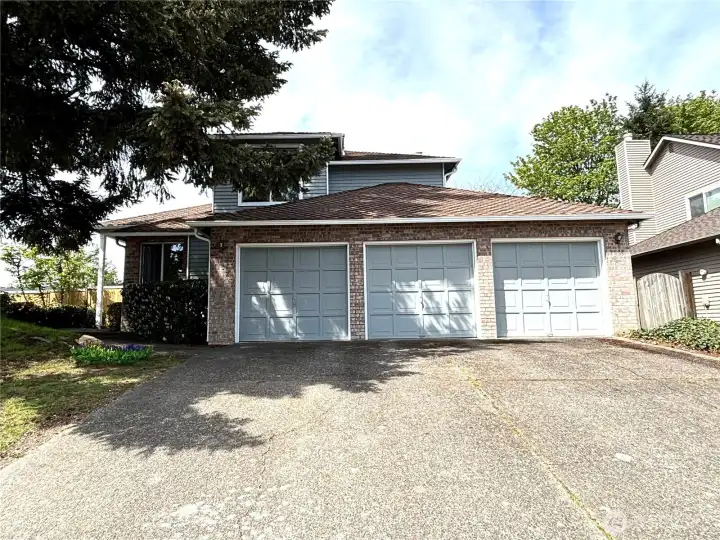 3 car garage and long driveway