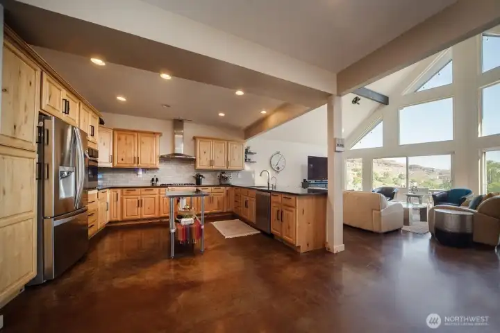 View of the custom kitchen and living space.