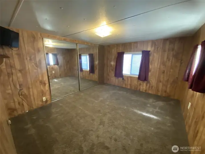 Bedroom has newer carpet large closet and built in mirror on closet