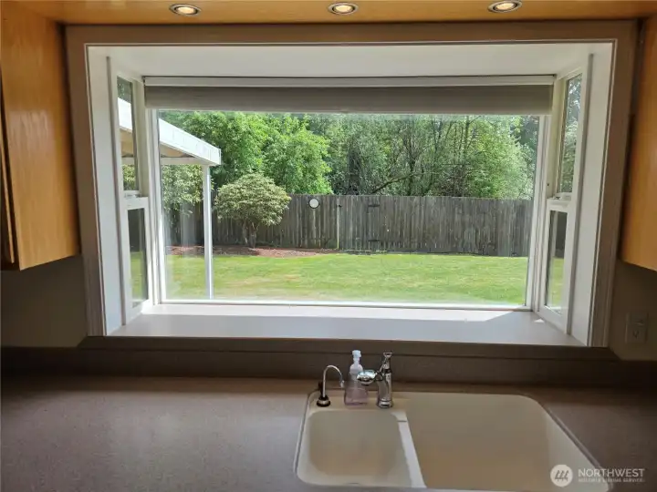 Bay window with view of back yard.