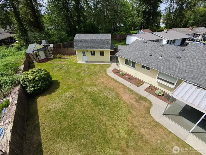 Another view to see the size of the back yard and out buildings.