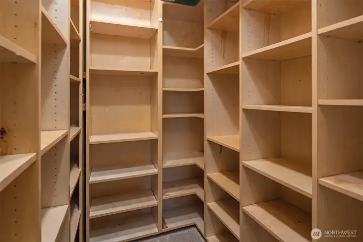 Primary bedroom walk-in closet