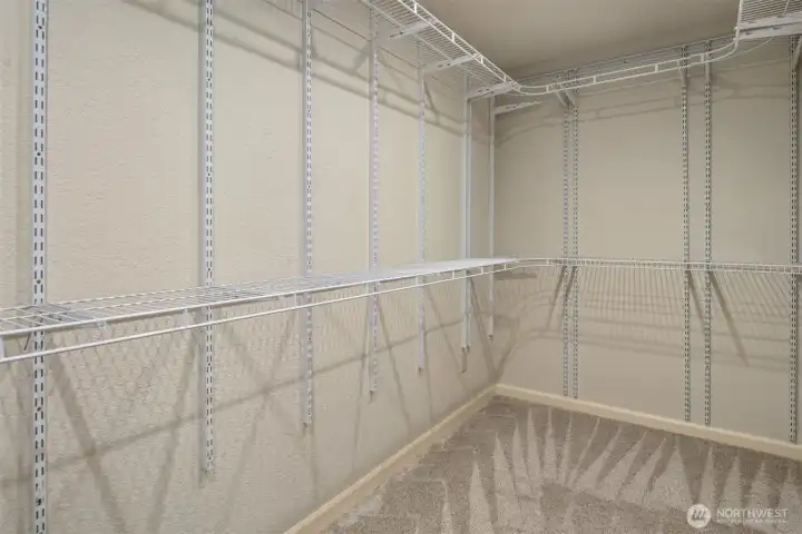 Primary bedroom walk-in closet