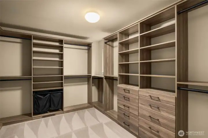One of 2 custom built-in closets in the primary suite. One of 2 custom built-in closets in the primary suite.
