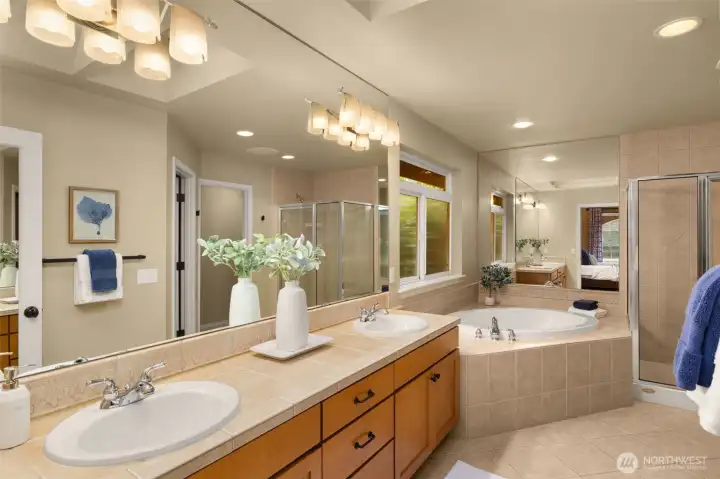 The primary, 5-piece bath, features a large soaking tub, double sinks, shower, separate toilet area, and a walk-in closet. The primary, 5-piece bath, features a large soaking tub, double sinks, shower, separate toilet area, and a walk-in closet.