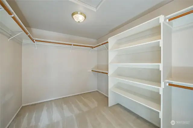 Giant walk-in closet with levels and shelves