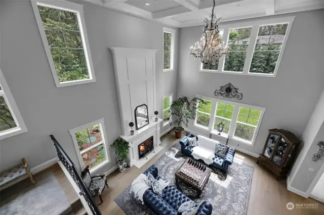 As you head to the upper level, you are taken by how grand the family room is. Large windows bringing in the natural light.