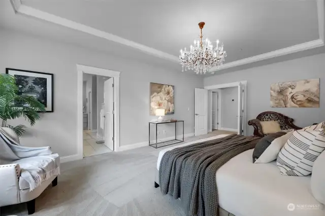Quality details including a tray ceiling and another Restoration Hardware chandelier.
